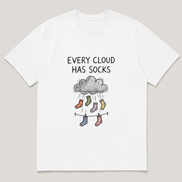 Front view of a White Tee printed with gray cloud rains single socks onto a tiny clothesline and the caption EVERY CLOUD HAS SOCKS