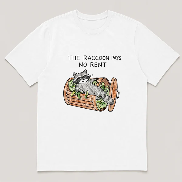 Front view of a White Tee printed with raccoon lounges like a king inside an overturned trash can with peelings as cushions and the caption THE RACCOON PAYS NO RENT