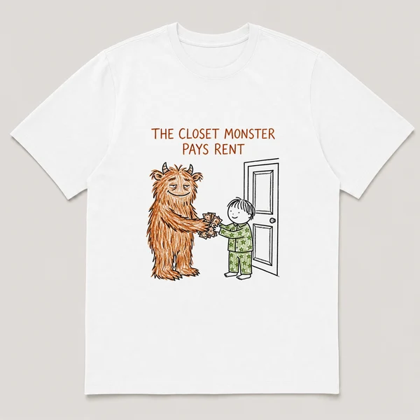Front view of a White Tee printed with a furry monster hands crumpled bills to a kid in pajamas beside a closet door and the caption THE CLOSET MONSTER PAYS RENT