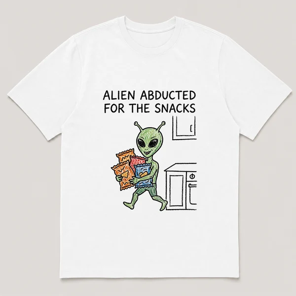 Front view of a White Tee printed with small alien tiptoes out of a kitchen carrying an armful of chip bags and the caption ALIEN ABDUCTED FOR THE SNACKS